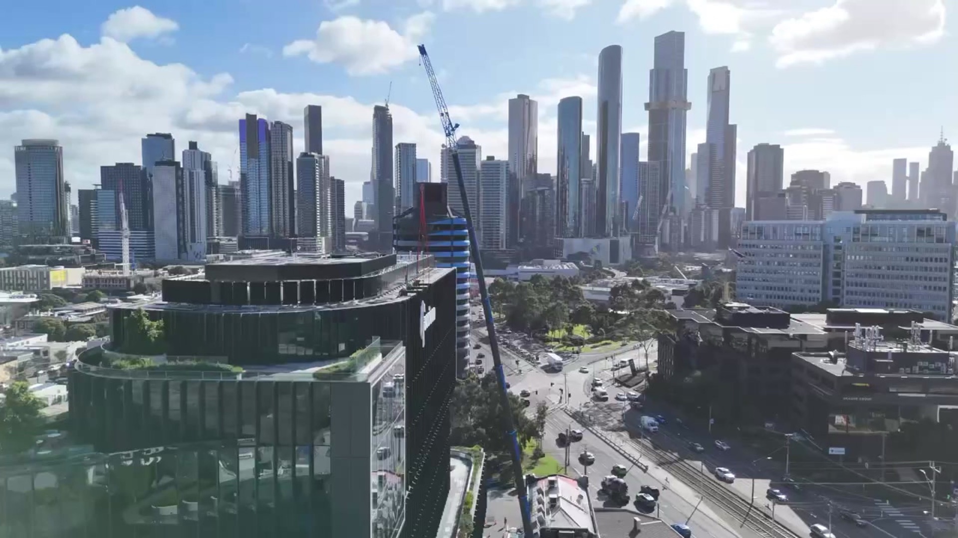 Acciona sky sign installation with the Melbourne skyline